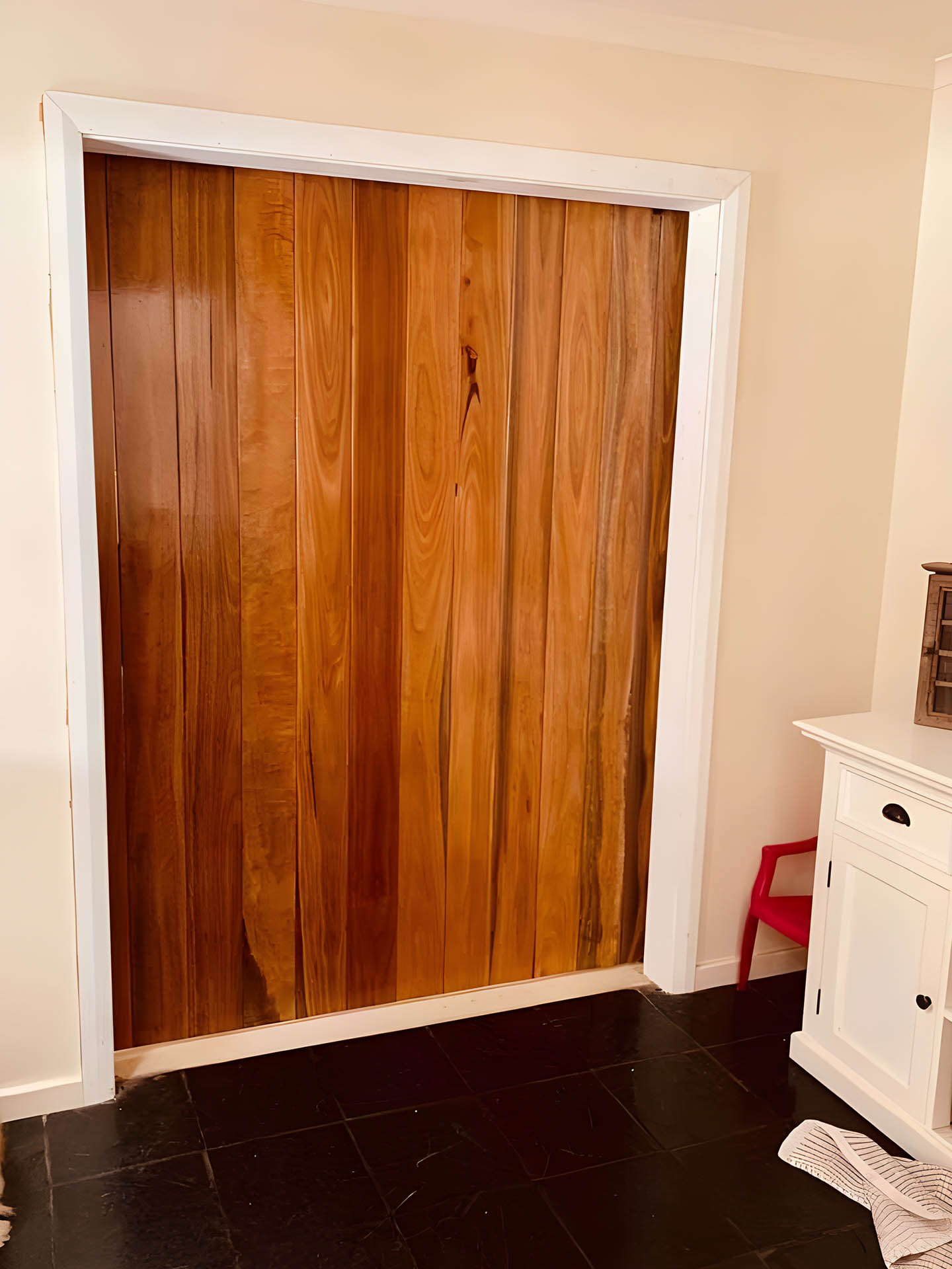2-about1-rs Tall timber doors fitted in a white-framed doorway