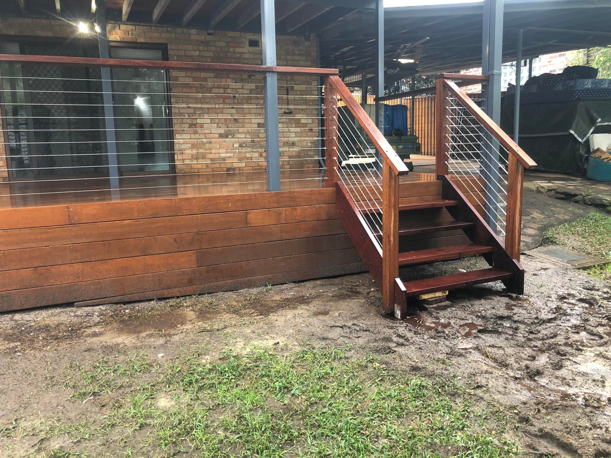 5-pic2 Timber deck with wire balustrade and stairs beside a brick house